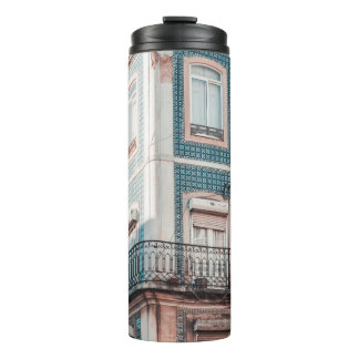 WHITE AND BLUE CONCRETE BUILDING THERMAL TUMBLER