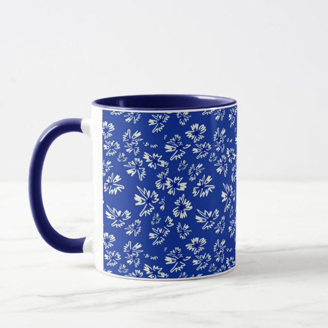 white and blue floral pattern mug (Left)