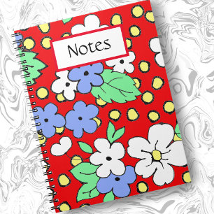White and blue flowers on red spiral notebook