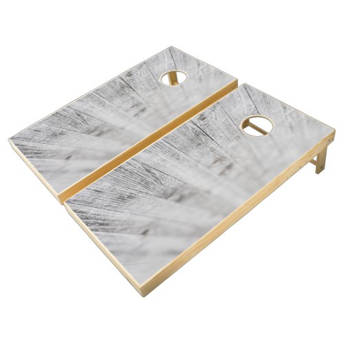 White and brown wooden board cornhole set