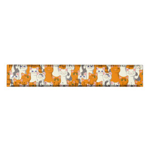 White and ginger cats pattern green eyes blue eyes ruler