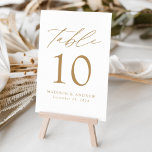White and Gold Modern Elegance Wedding Table Number<br><div class="desc">Trendy, minimalist wedding table number cards featuring gold modern lettering with "Table" in modern calligraphy script. The design features a white background or a color of your choice. The design repeats on the back. To order the table cards: add your name, wedding date, and table number. Add each number to...</div>