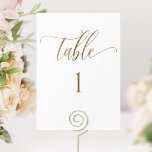 White and Gold Modern Minimalist Table Number<br><div class="desc">Help your guests find their table with this elegant modern white and gold table number. Double-sided cards. Clear space all around gives you the liberty to use a table holder or frame. Attractive "table" in modern handwritten calligraphy in faux gold foil print. Background color in white, which can be changed...</div>