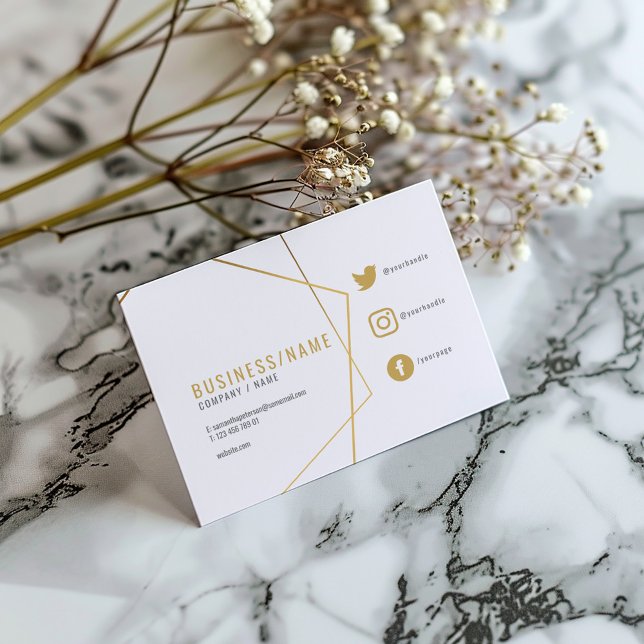 White and gold social media business card (White business card with gold geometric lines, social icons, and modern typography.)