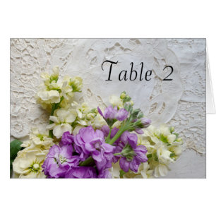 White and purple flowers on old lace cards