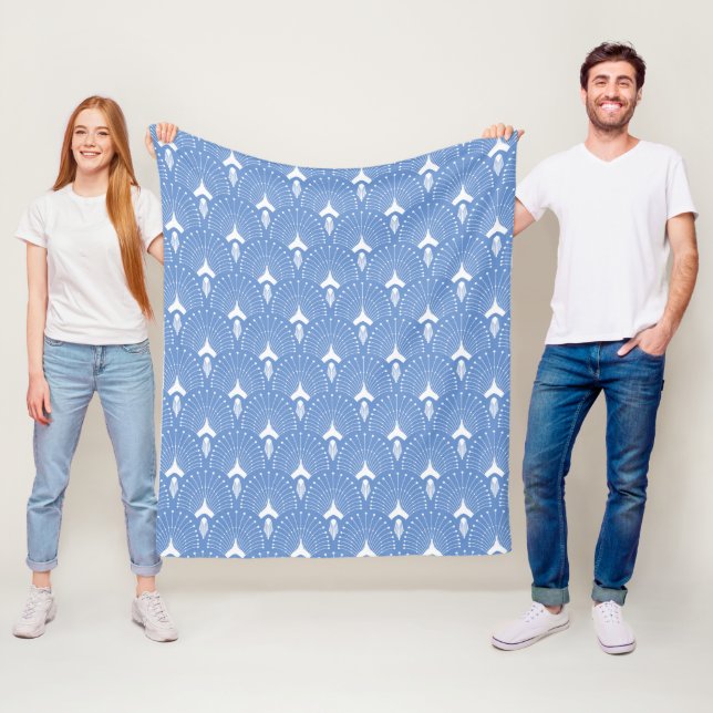 White art-deco pattern on blue fleece blanket (In Situ)