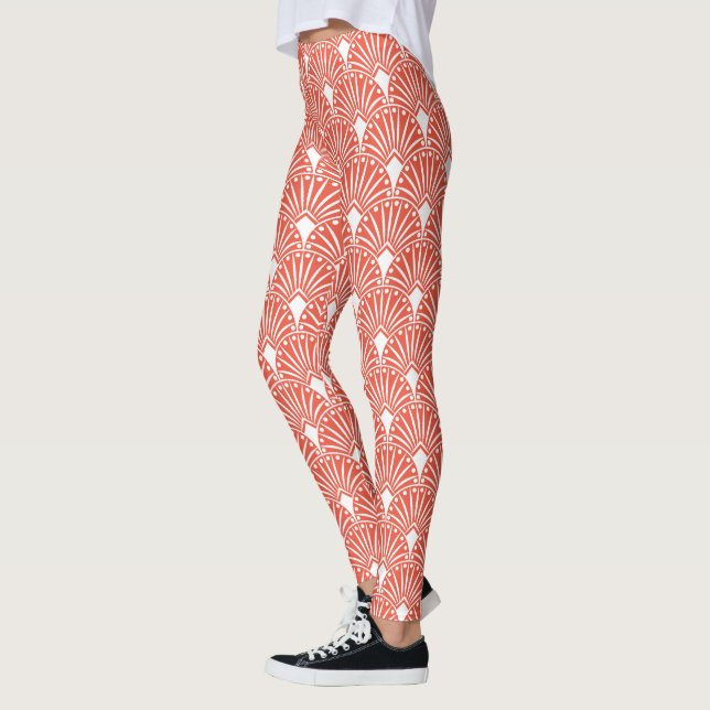 White art deco pattern over orange background leggings (Left)