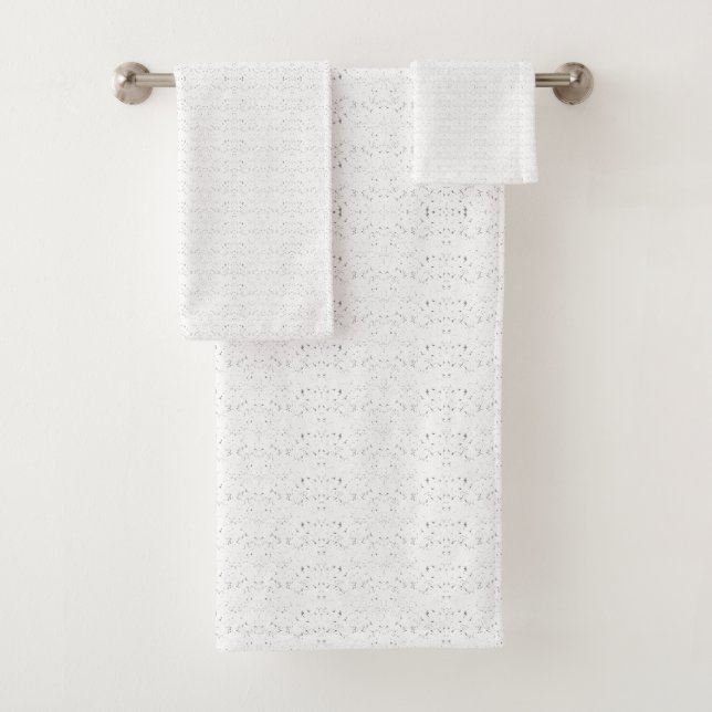White background with a repeating pattern of small bath towel set (Insitu)