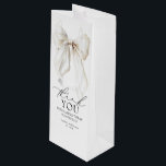White Bow Bridal Shower Thank You Favors Wine Gift Bag<br><div class="desc">Add a Romantic Touch with These Elegant White Bow Thank You Wine Gift Bags. Thoughtfully designed with a graceful white satin bow and a heartfelt message — “Thank you” and “For making today so special” — these wine gift bags offer a timeless way to show appreciation. Whether you're gifting a...</div>
