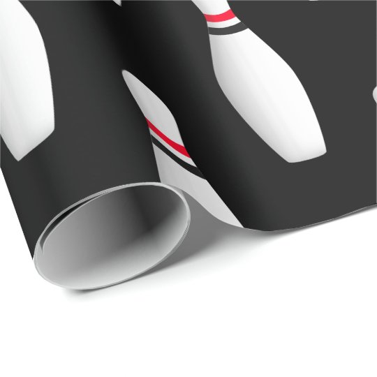 white bowling pins on black wrapping paper