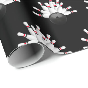 white bowling pins on black wrapping paper