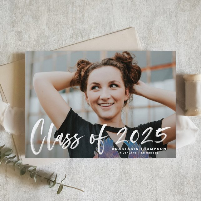 White Brush Lettering 2025 Photo Graduation Announcement Postcard (Customizable Photo Graduation Announcement Postcard featuring brush lettering overlay)