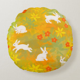 White bunnies on a flower field round pillow