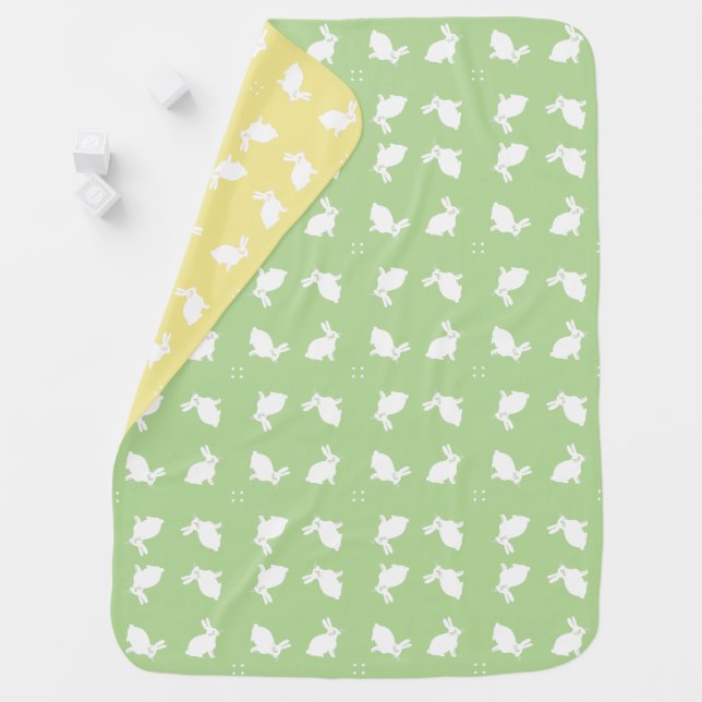 White bunny rabbits on pale green and lemon baby blanket (In Situ)