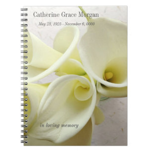 White calla lilies from above memorial notebook