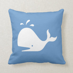 white CARTOON whale  on  blue pillow