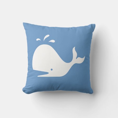 white CARTOON whale  on  blue pillow