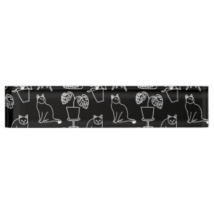 White cats on black desk name plate