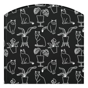White cats on black door sign