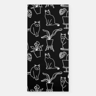 White cats on black magnetic notepad