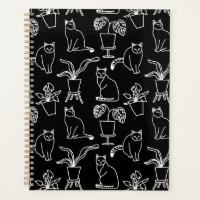 White cats on black planner