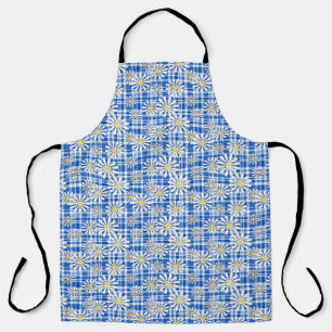 White chamomile flowers on a blue checkered backgr apron