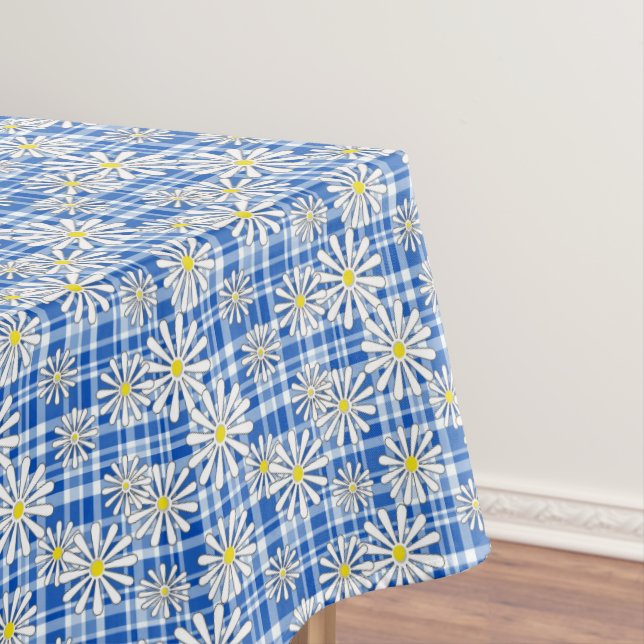 White chamomile flowers on a blue checkered backgr tablecloth (In Situ)
