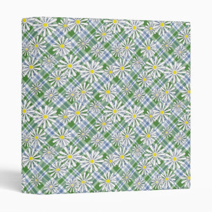 White chamomile flowers on a green blue checkered 3 ring binder