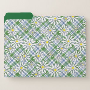 White chamomile flowers on a green blue checkered file folder