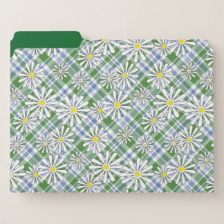 White chamomile flowers on a green blue checkered  file folder