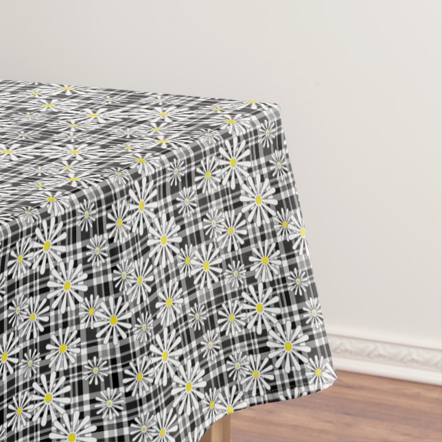 White chamomile flowers on black white checkered b tablecloth (In Situ)