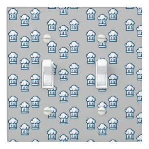 White chef hats on grey light switch cover