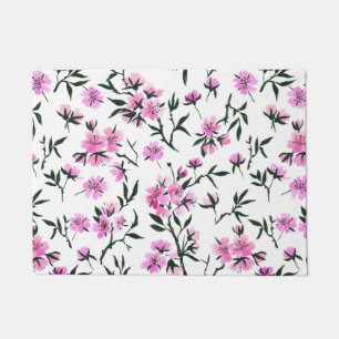 White cherry blossom on white doormat