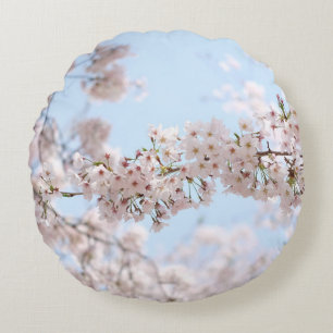 White cherry blossom under clear blue sky in the m round pillow
