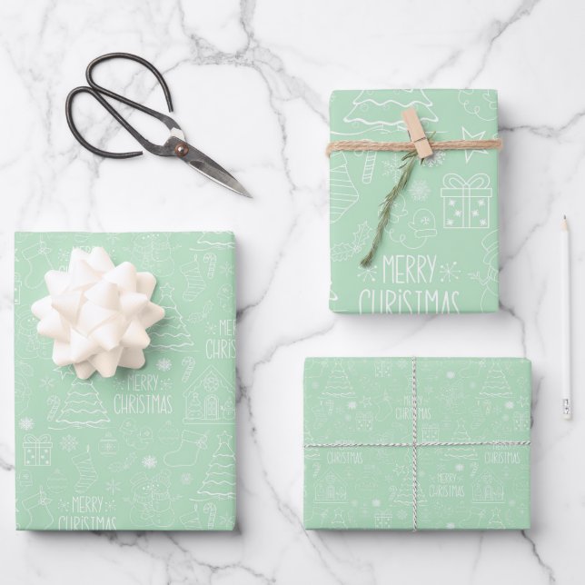 White Christmas Outlines on Light Green Wrapping Paper Sheets (Front)