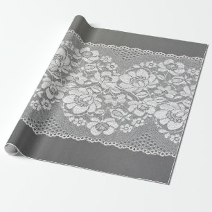 White color straight strip of lace fabric on gray wrapping paper