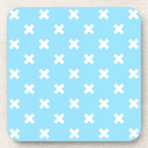 White cross stitches on baby blue beverage coaster