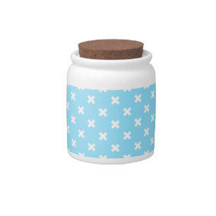 White cross stitches on baby blue candy jar