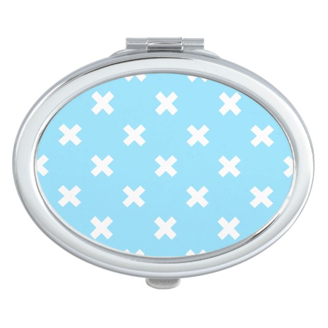 White cross stitches on baby blue compact mirror (Front)