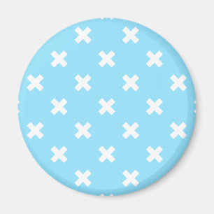 White cross stitches on baby blue magnet