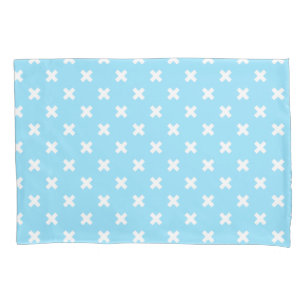 White cross stitches on baby blue pillow case