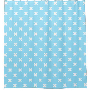 White cross stitches on baby blue shower curtain