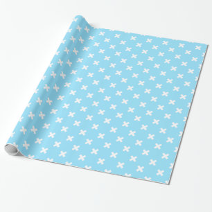 White cross stitches on baby blue wrapping paper