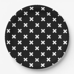 White cross stitches on black paper plates