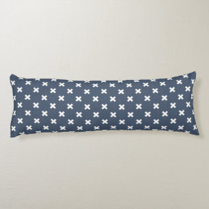 White cross stitches on blue-gray body pillow