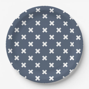 White cross stitches on blue-gray paper plates