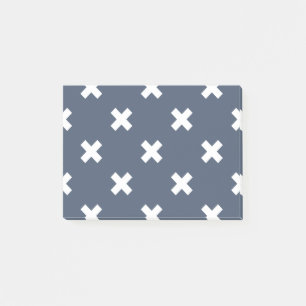 White cross stitches on blue-gray post-it notes