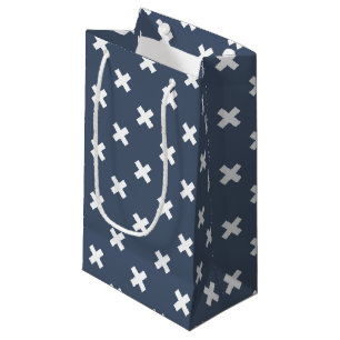 White cross stitches on blue-gray small gift bag