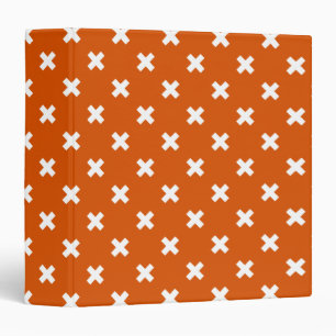White cross stitches on burnt orange 3 ring binder