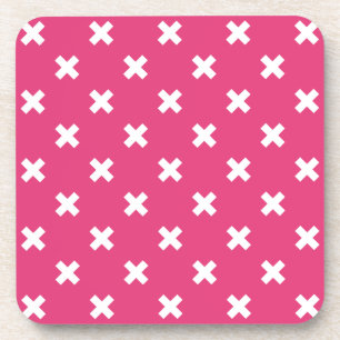 White cross stitches on fuchsia beverage coaster
